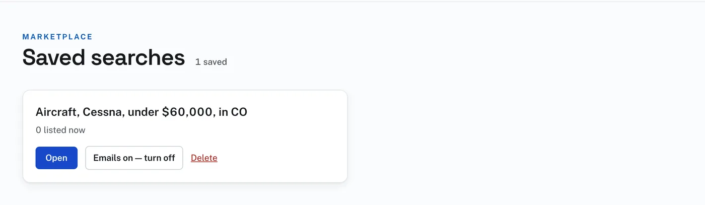 The Saved searches page with one saved search: Open, the email button and Delete.